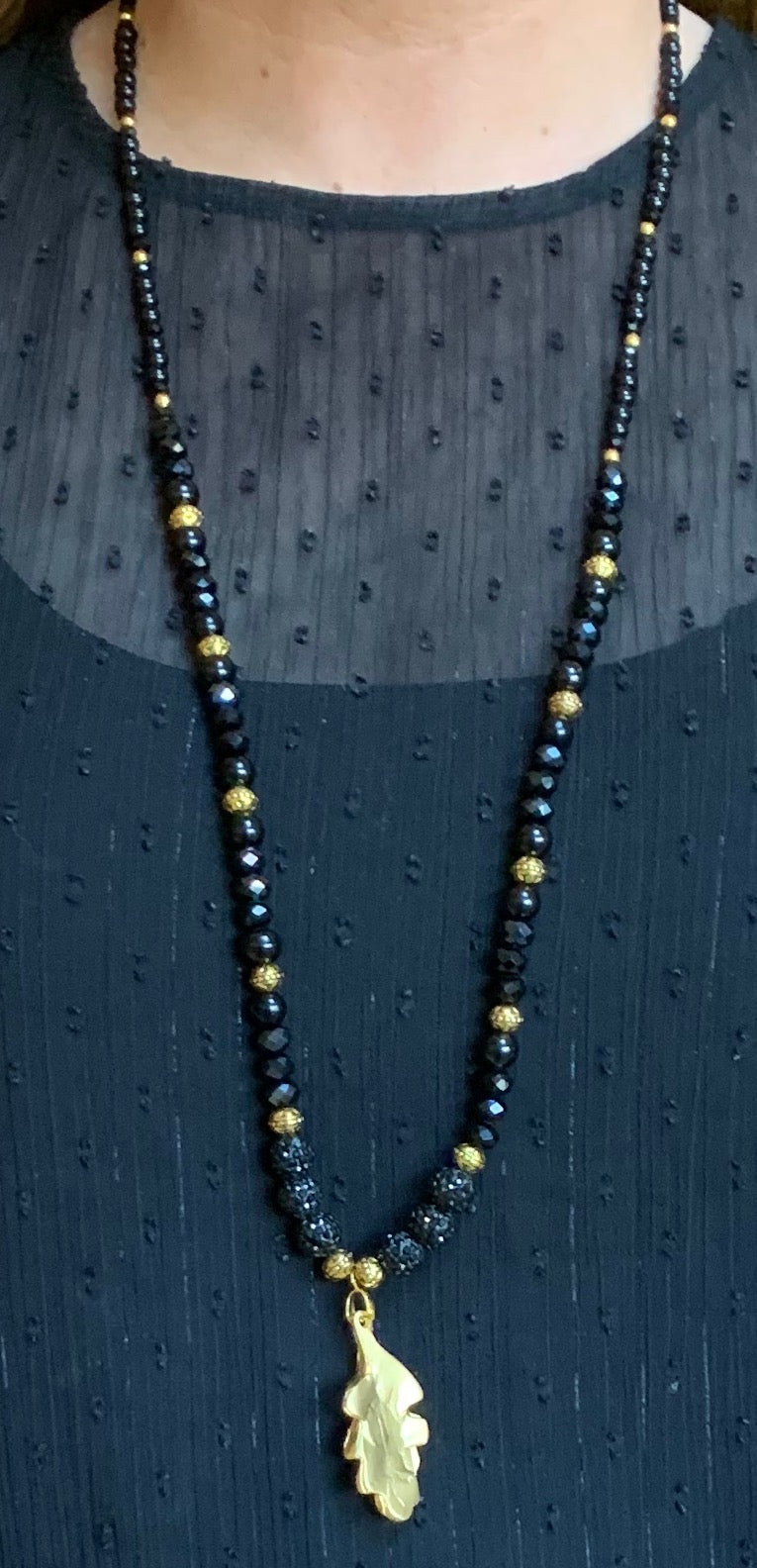Black crystal and gold leaf necklace