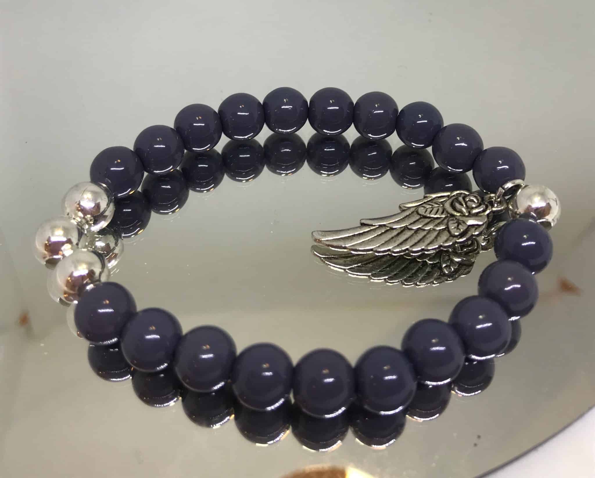 Charcoal grey bracelet with silver angel wing.