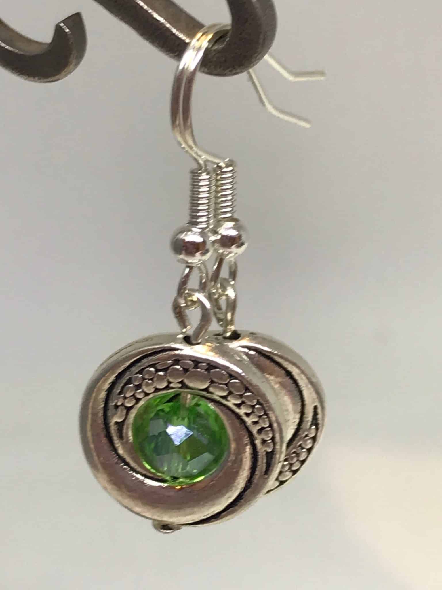 Antique silver Tibetan earrings with emerald green crystal